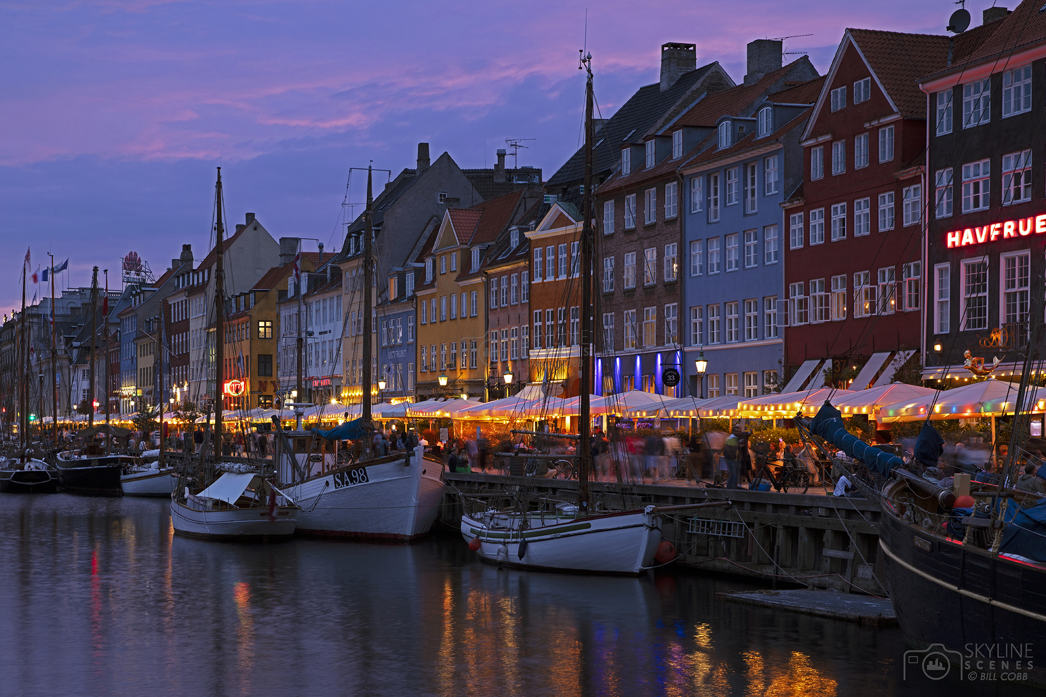 Nyhavn canal at sunset in Copenhagen images for sale by Skylinescenes.