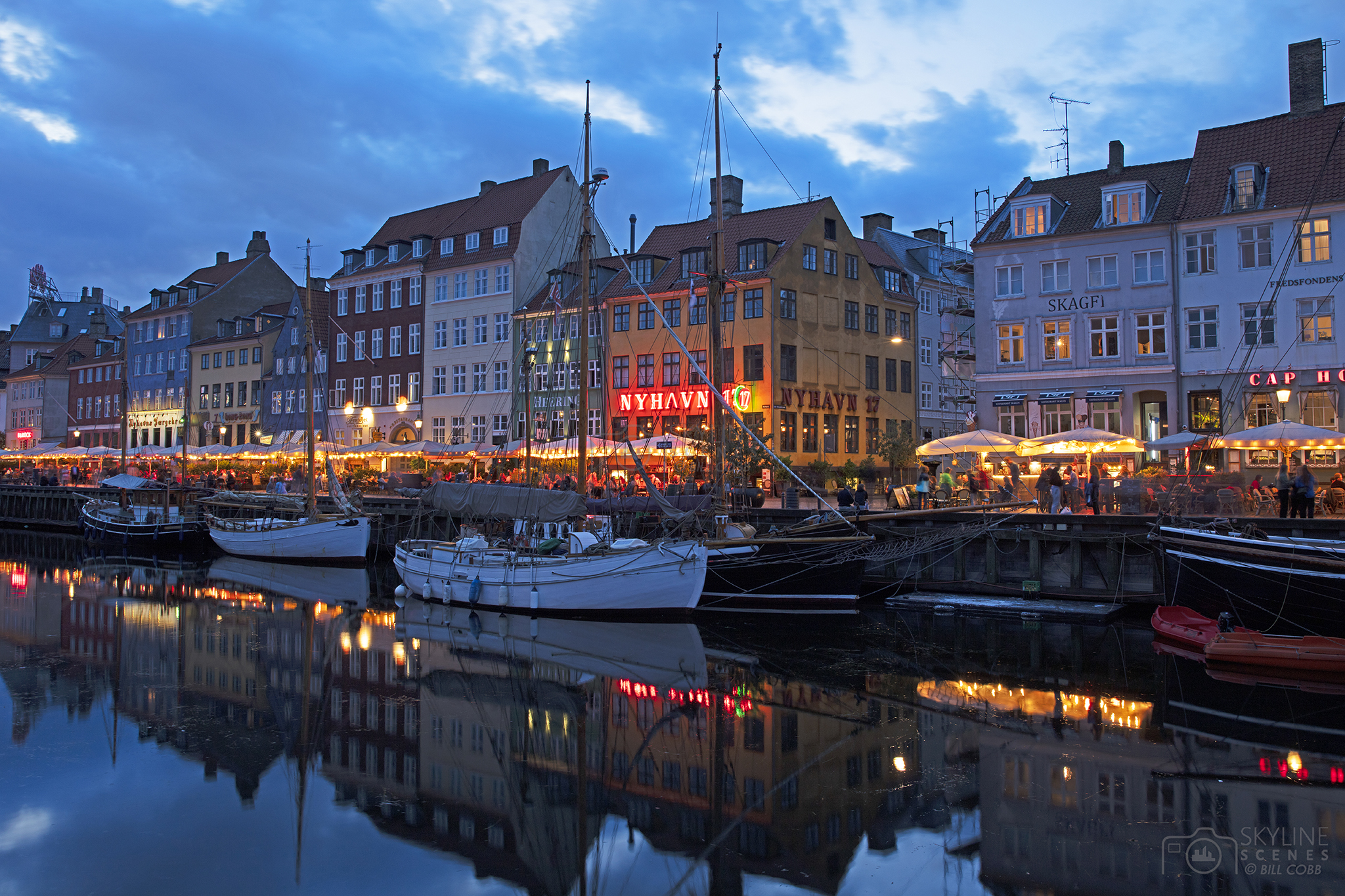Nyhavn district and canal at sunset in Copenhagen images for sale by Skylinescenes.